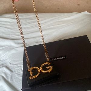 Black with gold letters dolce and gabbana chain bag
